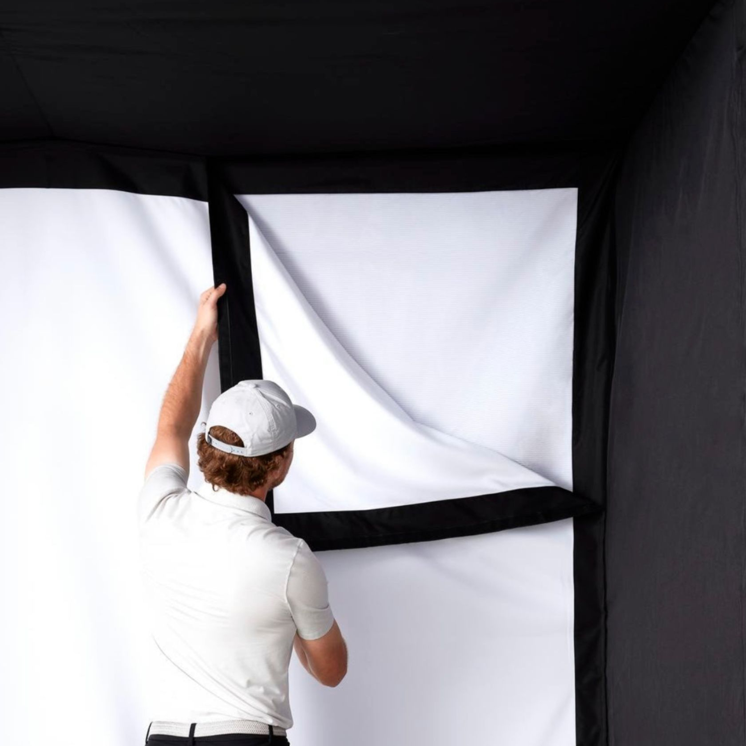 Installing SKYTRAK golf sim studio single layer impact screen 