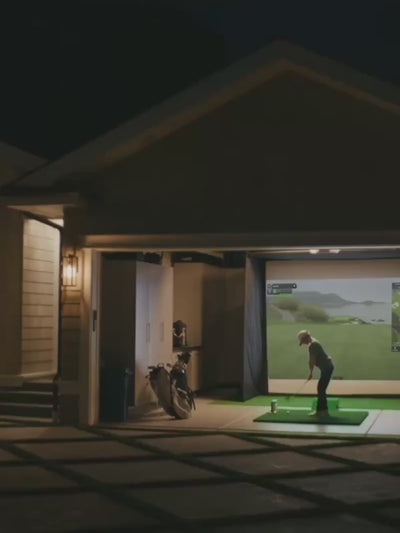See how easy it is to practice at home—this mobile-friendly video shows a garage transformed into an immersive golf studio, perfect for evening play and family fun.